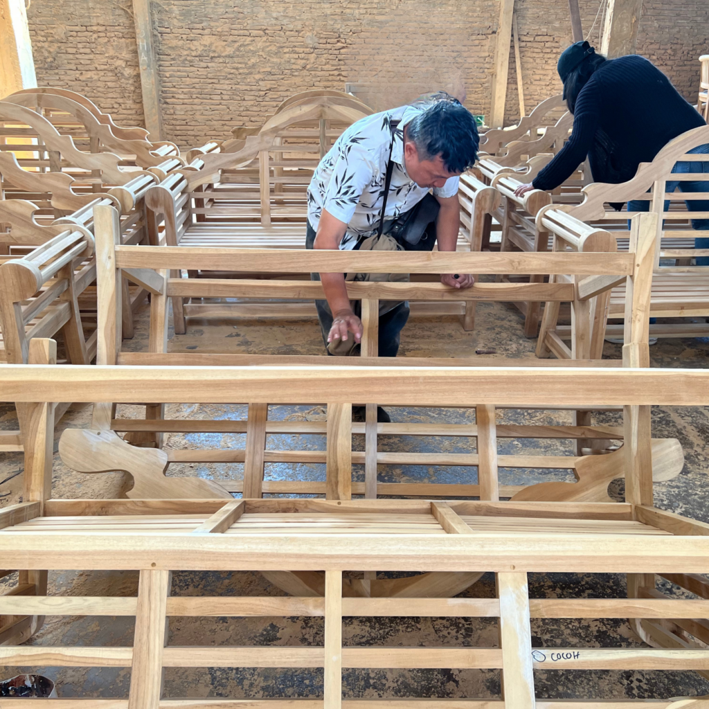 Artisans producing teak furniture on the Antex Jaya Exim workshop floor